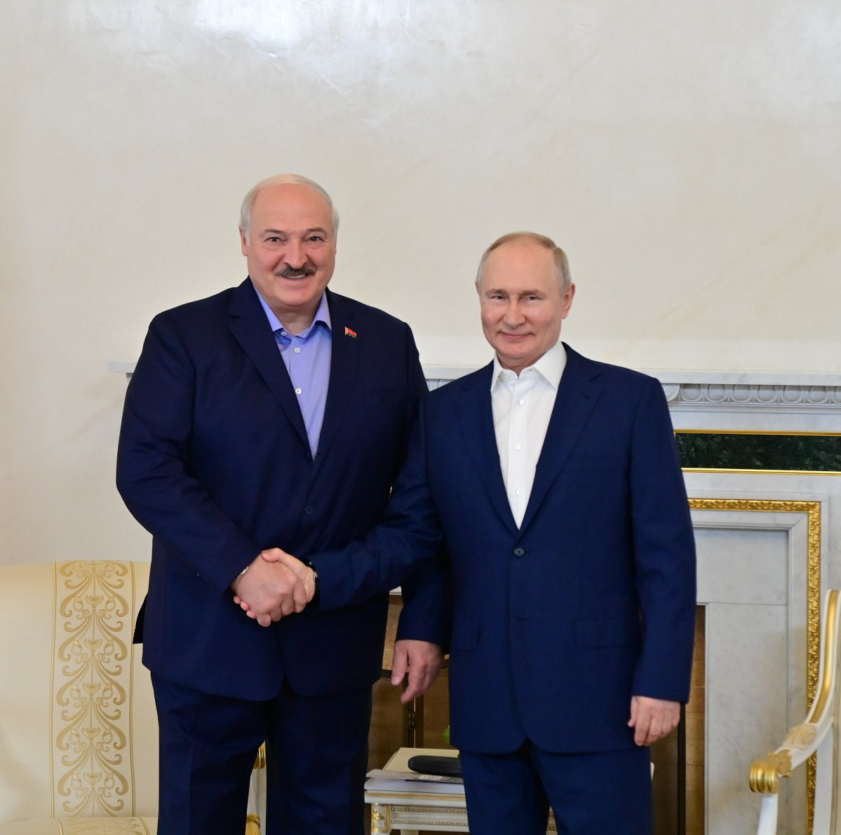 President of Belarus Aleksandr Lukashenko handshaking with President of Russia Vladimir Putin
